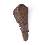 A GEORGE II CARVED WOOD AND PAINTED MASK CORBEL OR WALL MOUNT, MID 18TH CENTURY