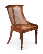 A REGENCY BEECH 'CURRICLE' LIBRARY ARMCHAIR, ATTRIBUTED TO GILLOWS, CIRCA 1815