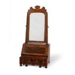 A QUEEN ANNE FIGURED WALNUT, OYSTER VENEERED AND FEATHER BANDED DRESSING MIRROR, CIRCA 1710