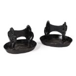 A PAIR OF REGENCY CAST IRON AND BLACK PAINTED BOOT SCRAPES IN THE MANNER OF WILLIAM BULLOCK