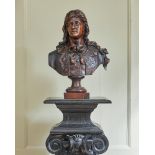 AN ITALIAN CARVED WALNUT PORTRAIT BUST OF A GENTLEMAN, 17TH CENTURY