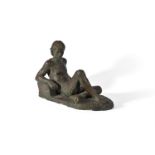 λ KARIN JONZEN (BRITISH 1914-1998), A BRONZED PLASTER FIGURE OF 'LOUNGING MALE YOUTH'