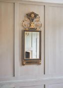 AN EBONISED AND PARCEL GILT WALL MIRROR, LATE 18TH OR EARLY 19TH CENTURY