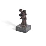 MANNER OF BARTHELEMY PRIEUR, A BRONZE MODEL OF A FEMALE PEDLAR, LATE 17th OR EARLY 18TH CENTURY