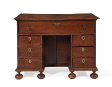 A WILLIAM III OAK KNEEHOLE DESK OR LIBRARY TABLE, CIRCA 1700