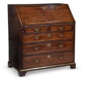 A GEORGE II MAHOGANY AND BRASS INLAID BUREAU, IN THE MANNER OF JOHN CHANNON, CIRCA 1745