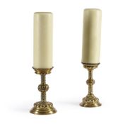 A PAIR OF EMBOSSED BRASS CANDLESTICKS, IN THE 17TH CENTURY STYLE