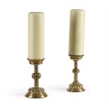 A PAIR OF EMBOSSED BRASS CANDLESTICKS, IN THE 17TH CENTURY STYLE