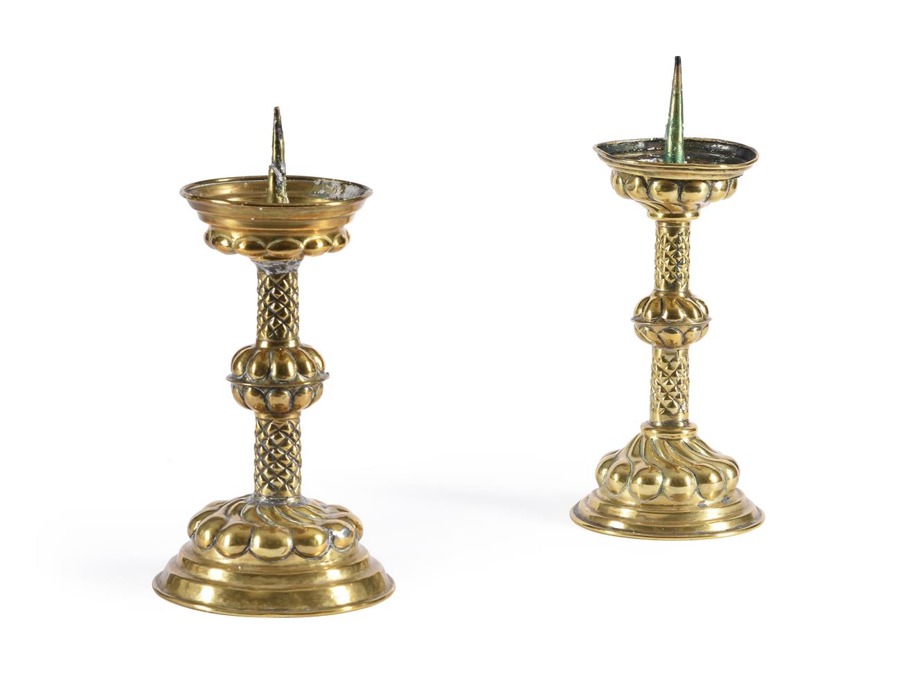 A PAIR OF EMBOSSED BRASS CANDLESTICKS, IN THE 17TH CENTURY STYLE - Image 2 of 3