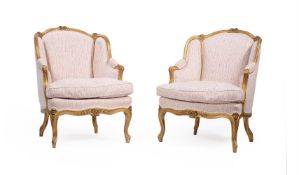 A PAIR OF CARVED GILTWOOD AND UPHOLSTERED BERGERE ARMCHAIRS, IN LOUIS XV STYLE, LATE 19TH CENTURY
