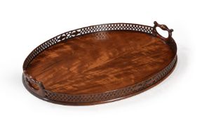A GEORGE III MAHOGANY OVAL TRAY IN THE MANNER OF THOMAS CHIPPENDALE, CIRCA 1770