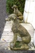 A PAIR OF COMPOSITION STONE FIGURES OF HOUNDS, 20TH CENTURY