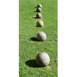 A SET OF SIX CORNISH GRANITE BALLS, PROBABLY EARLY 20TH CENTURY