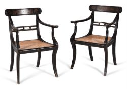 A SET OF SIX LATE GEORGE III BLACK AND POLYCHROME PAINTED ARMCHAIRS, CIRCA 1810