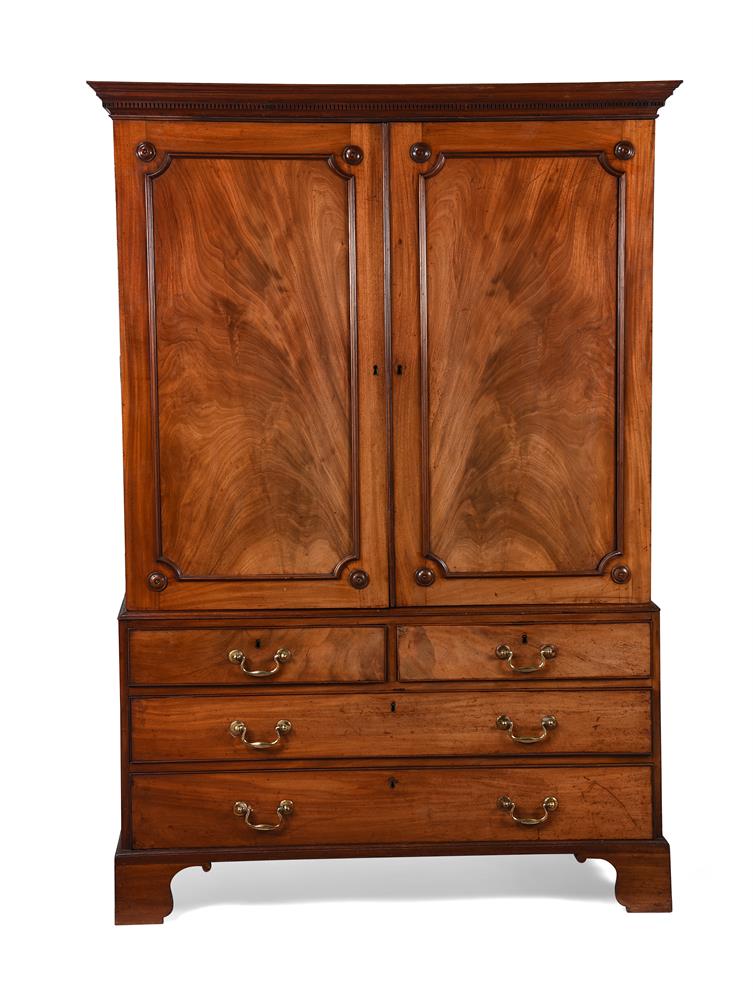 A GEORGE III MAHOGANY CLOTHES PRESS IN THE MANNER OF HENRY KETTLE, CIRCA 1780