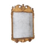 A GEORGE I GILTWOOD AND GESSO WALL MIRROR, CIRCA 1720