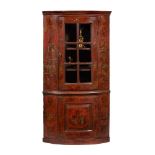 A GEORGE I RED LACQUER AND GILT CHINOISERIE DECORATED CORNER CABINET, CIRCA 1720