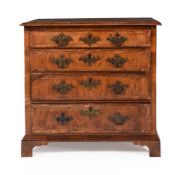 A GEORGE II WALNUT AND FEATHER BANDED CHEST OF DRAWERS, CIRCA 1740