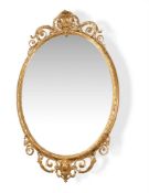 A VICTORIAN GILTWOOD AND COMPOSITION OVAL WALL MIRROR THIRD QUARTER, 19TH CENTURY