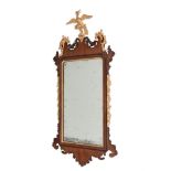 A GEORGE III MAHOGANY AND PARCEL GILT WALL MIRROR, POSSIBLY IRISH, CIRCA 1770