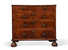 A QUEEN ANNE FIGURED WALNUT AND FEATHER BANDED CHEST OF DRAWERS, CIRCA 1710