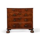 A QUEEN ANNE FIGURED WALNUT AND FEATHER BANDED CHEST OF DRAWERS, CIRCA 1710