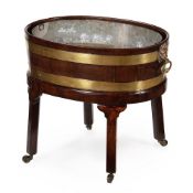 A GEORGE III MAHOGANY AND BRASS BOUND WINE COOLER, IN THE MANNER OF THOMAS CHIPPENDALE, CIRCA 1770