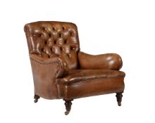A LATE VICTORIAN BUTTONED LEATHER UPHOLSTERED ARMCHAIR IN THE MANNER OF HOWARD & SONS