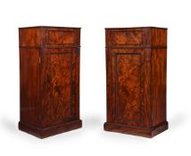 A PAIR OF GEORGE III FIGURED MAHOGANY PEDESTAL LIBRARY CABINETS, CIRCA 1800