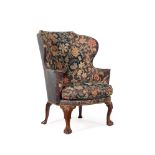 A GEORGE II WALNUT WING ARMCHAIR, CIRCA 1735