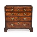 A GEORGE II BURR WALNUT CHEST OF DRAWERS, SECOND QUARTER 18TH CENTURY