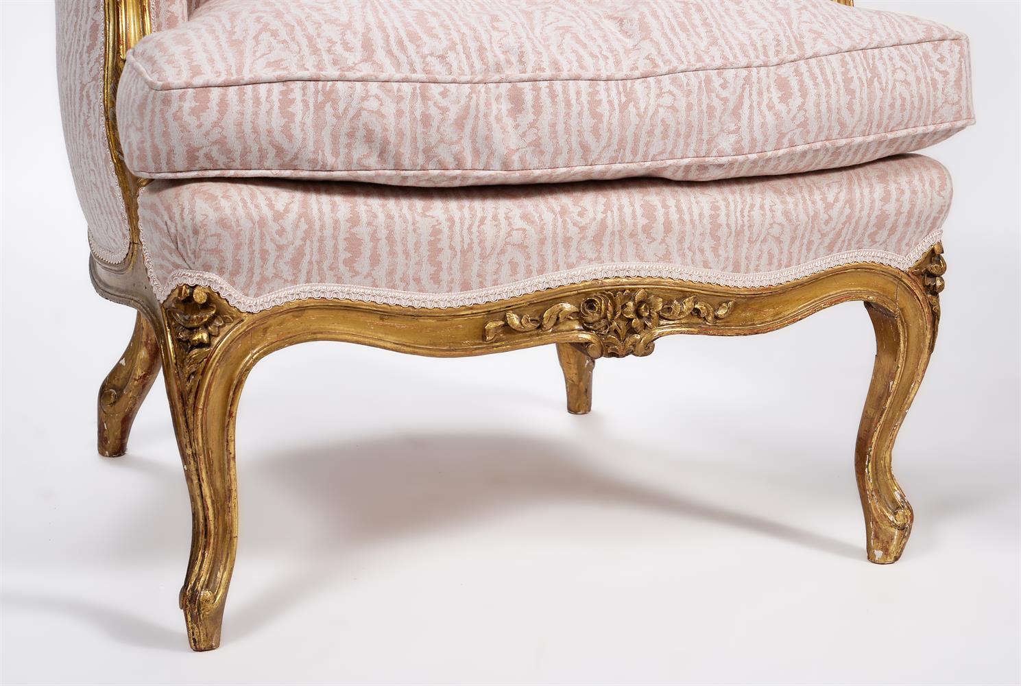 A PAIR OF CARVED GILTWOOD AND UPHOLSTERED BERGERE ARMCHAIRS, IN LOUIS XV STYLE, LATE 19TH CENTURY - Image 3 of 3