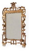 A CARVED GILTWOOD WALL MIRROR, IN IRISH GEORGE II STYLE, SECOND QUARTER 19TH CENTURY