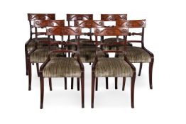 A SET OF EIGHT REGENCY MAHOGANY DINING CHAIRSIN THE MANNER OF THOMAS HOPE