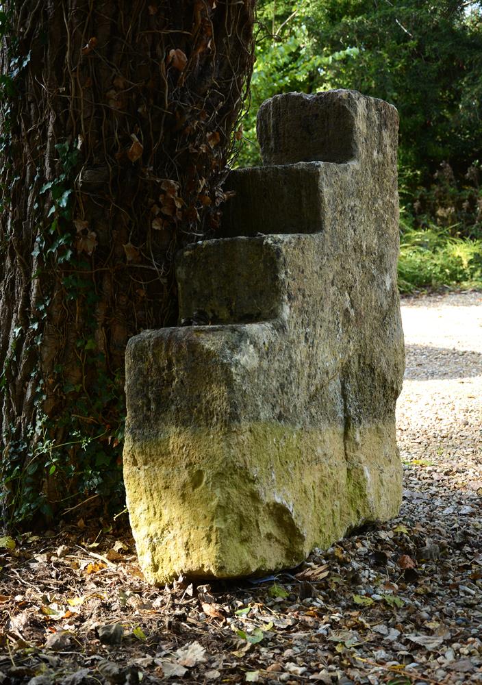 A COTSWOLD STONE MOUNTING BLOCK, 18TH CENTURY