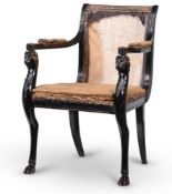 A LATE GEORGE III EBONISED OPEN ARMCHAIR, IN THE MANNER OF THOMAS HOPE, CIRCA 1810