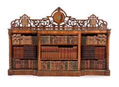A VICTORIAN WALNUT AND GILT METAL MOUNTED OPEN BOOKCASE, IN THE MANNER OF HOLLAND & SONS, CIRCA 1860