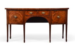 A GEORGE III MAHOGANY AND CROSSBANDED BOWFRONT SIDEBOARD, IN THE MANNER OF GILLOWS, CIRCA 1800