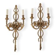 A PAIR OF GILT BRONZE TWO LIGHT WALL APPLIQUÉS, IN THE NEO-CLASSICAL TASTE