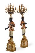 A PAIR OF GILTWOOD, COMPOSITION AND POLYCHROME PAINTED 'BLACKAMOOR' TORCHERES, MID 18TH CENTURY