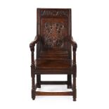 AN OAK PANEL BACK 'WAINSCOT' ARMCHAIR, MID 17TH CENTURY