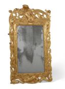 A CARVED GILTWOOD WALL MIRROR POSSIBLY IRISH, SECOND QUARTER 18TH CENTURY