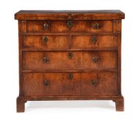 A GEORGE II WALNUT BACHELOR'S CHEST OF DRAWERS, CIRCA 1740