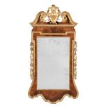 A GEORGE II WALNUT AND GILTWOOD WALL MIRROR, CIRCA 1740