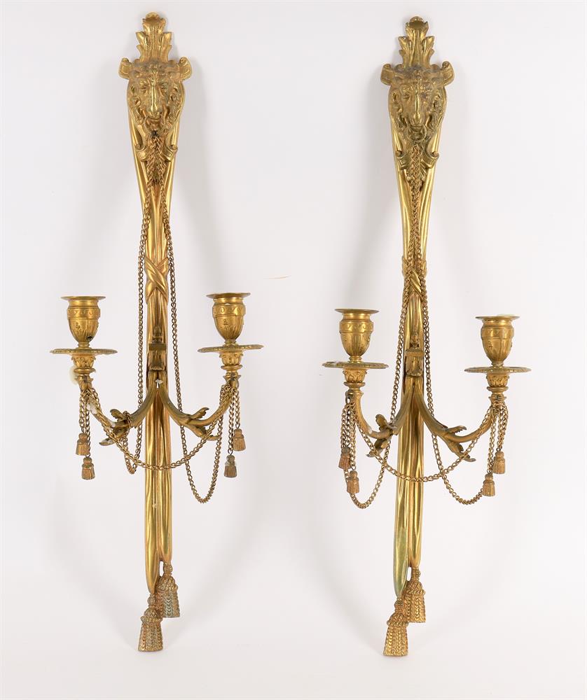 A pair of late 19th/early 20th century French gilt metal twin branch wall lights