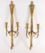 A pair of late 19th/early 20th century French gilt metal twin branch wall lights
