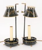 A pair of black and gilt tole style lamps