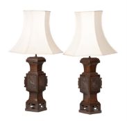 A pair of bronzed metal lamps