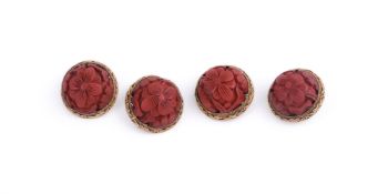 Four Chinese red lacquer and metal filigree buttons