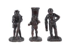 Three Continental carved and stained treen rustic figures